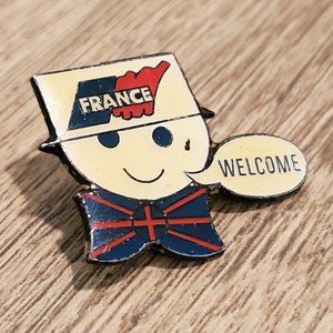 France smiley face welcome pin